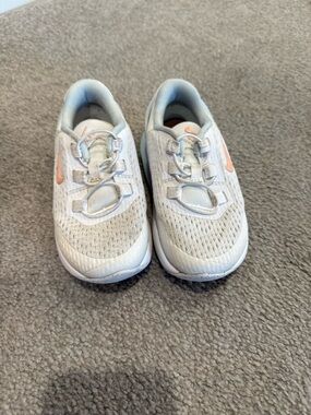 Nike Kids White Sneakers with Light Pink Swoosh